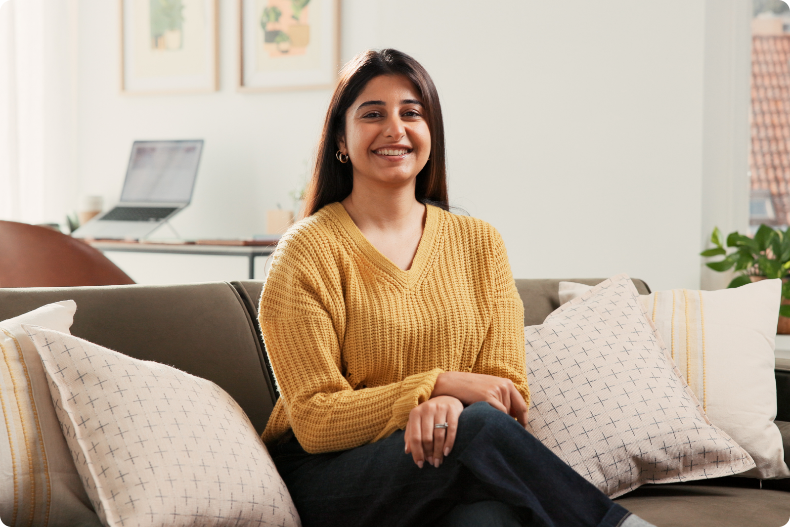 Therapist smiling in a comfortable home office setting